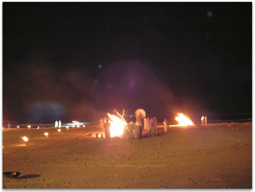 Orbs visible behind bonfires and smoke at the evocation of Les Saintes Maries de la Mer - large purple orb in the foreground