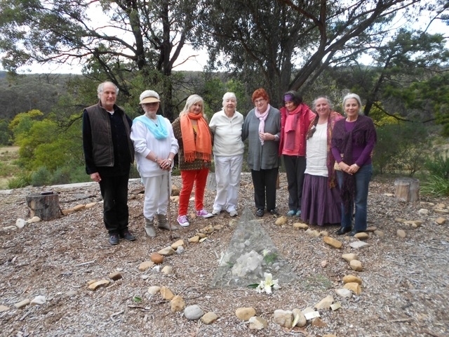 Group standing inside the bora ring with the Alcheringa Crystal in the 3 sided pyramid