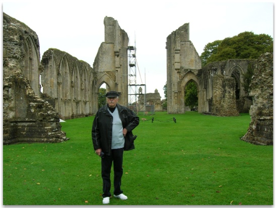 John Barrow standing at the ruins of the Chruch at Glastonbury Abbey