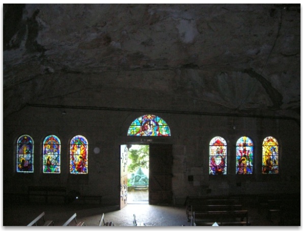 Stained glass at the entrance to the grotto at la Sainte-Baume. An orb is visible on the left of the doorway