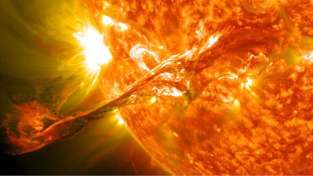 A Solar Flare streaks out from the Sun