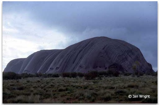 Photo of Ayers Rock - Uluru taken from the old road - storm approaching